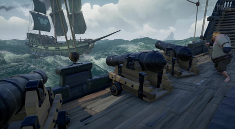 Pirate ship sailing in Sea of Thieves